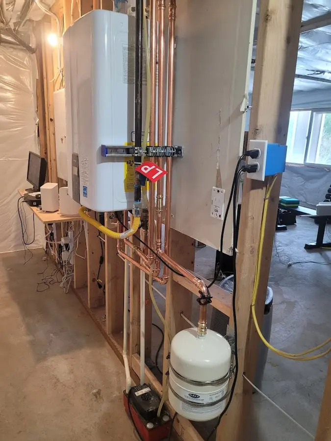 Licensed plumber repairing a kitchen sink in Williamsburg